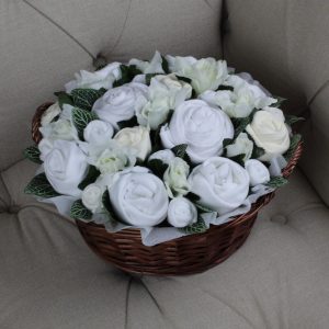 Twins Luxury Bouquet Neutral has 24 pretty buds of baby clothes each carefully and individually rolled to resemble a bloom.  They are beautifully presented in a 10" (25cm) willow basket with silk flowers and foliage