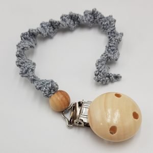 Grey baby dummy chain made of soft, safe materials, designed to attach a dummy securely to a stroller or clothing, included as part of the Silver Lining nappy cake baby gift set.