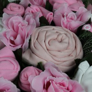 Twins luxury bouquet pink with baby clothes arranged as flowers in decorative basket