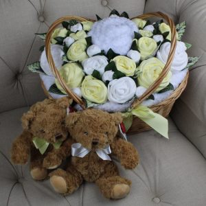 Twins Ultimate Bouquet Lemon is a basket of baby clothes rolled to look like flowers