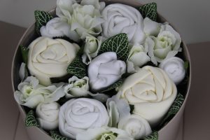Baby bouquets - A bouquet of baby clothes rolled to look like flowers from our shop - baby bouquets