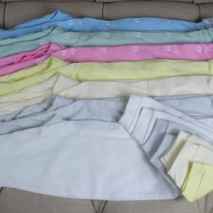 Baby sleepsuits in various colours and sizes