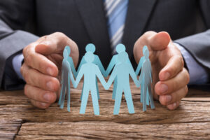 Businessman with arms supporting employees through life events